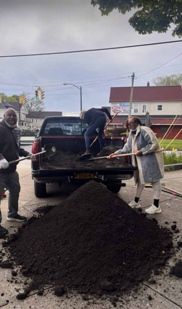 Volunteers improving the East Delavan and Wyoming neighborhood corner